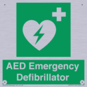 green-background-with-white-text-and-heart-defibrillator-symbol--white-cross-and~
